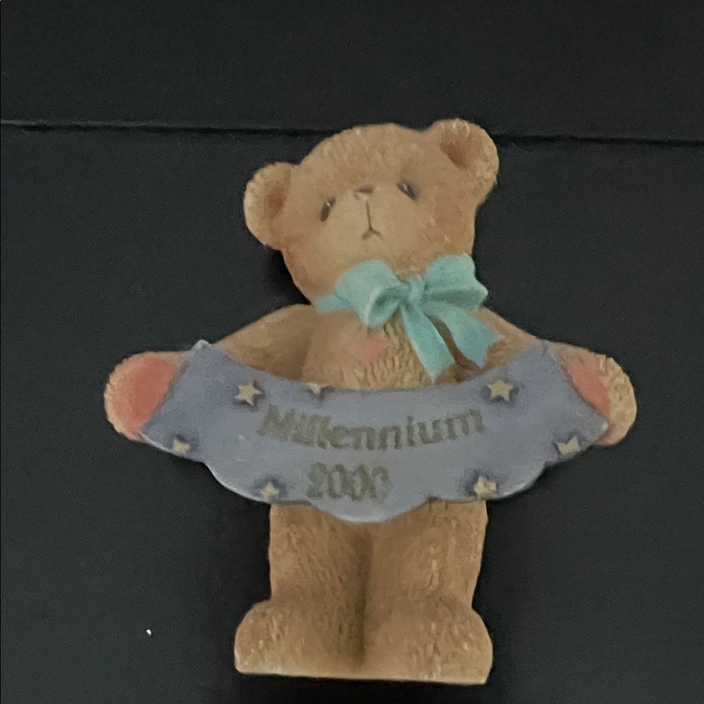 Charming Teddy Bear Figurine with Blue Bow